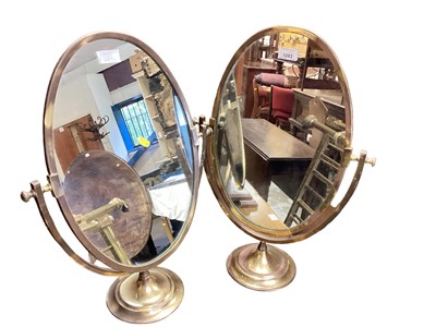 Lot 1283 - Pair of brass framed oval swing mirrors