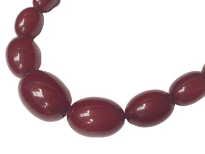 Lot 5 - Simulated cherry amber graduated oval bead necklace