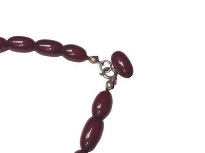 Lot 5 - Simulated cherry amber graduated oval bead necklace