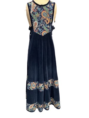 Lot 2098 - 1970s designer Anna Belinda handmade Oxford navy velvet and flora print pinafore maxi dress