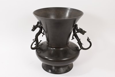 Lot 812 - Japanese bronze baluster vase with twin dragon handles