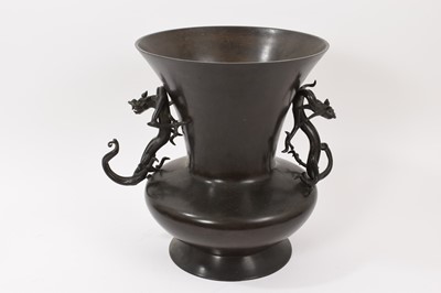 Lot 812 - Japanese bronze baluster vase with twin dragon handles