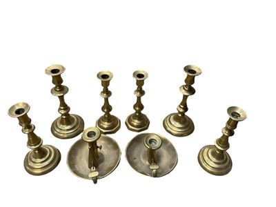 Lot 147 - Three pairs of Georgian brass candlesticks and two chamber sticks