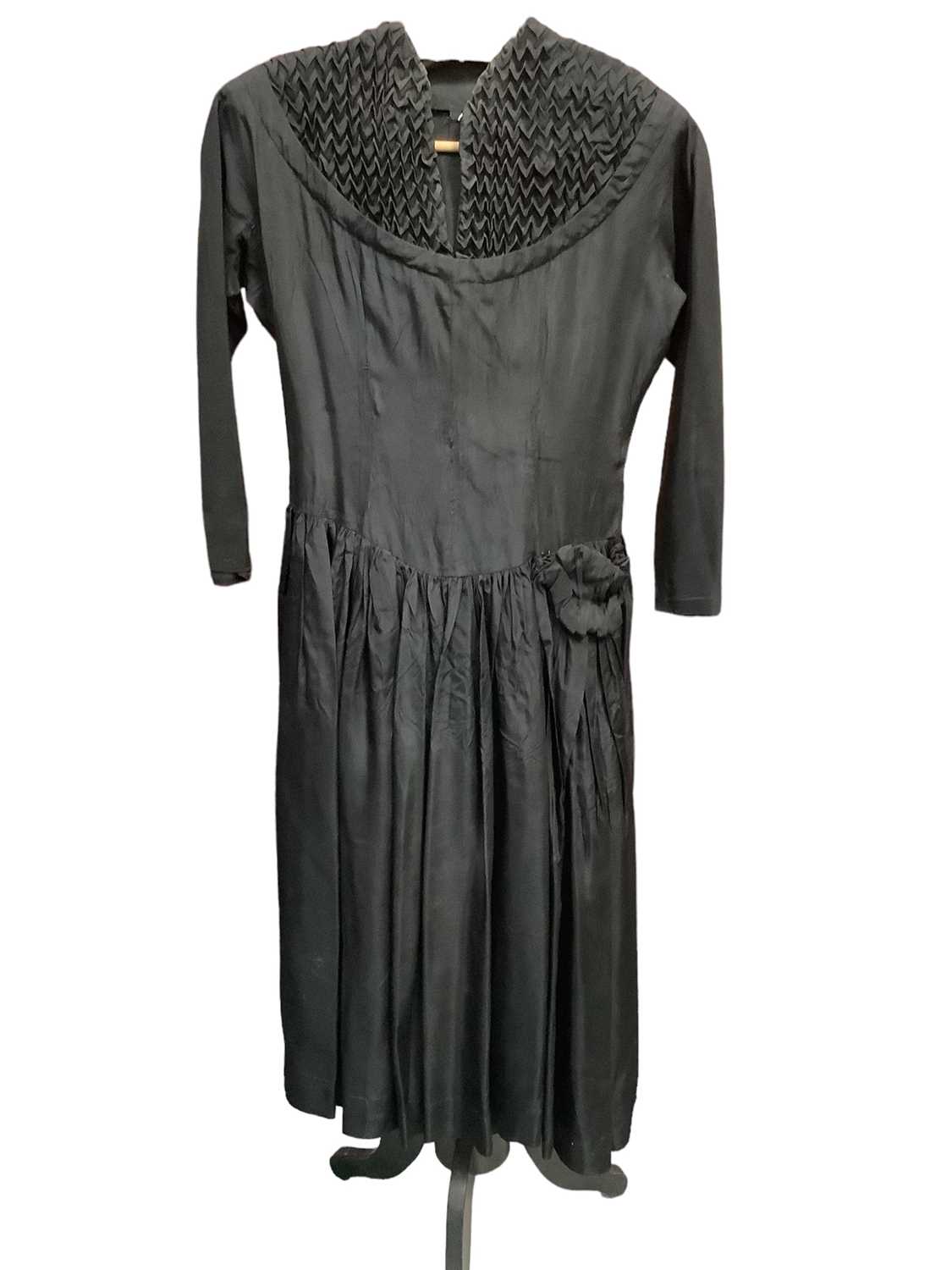 Lot 2102 - 1950s black cocktail dress (label cut), Frank Usher black evening dress with looped underskirt plus a Julian Rose boned bodice strapless evening dress with net and sequin skirt