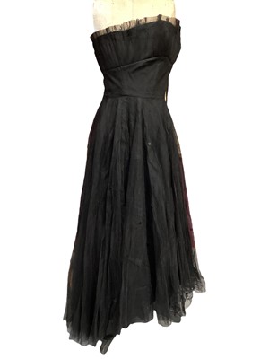 Lot 2102 - 1950s black cocktail dress (label cut), Frank Usher black evening dress with looped underskirt plus a Julian Rose boned bodice strapless evening dress with net and sequin skirt