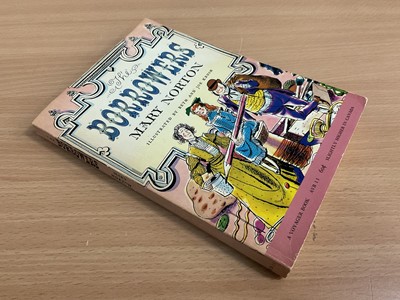 Lot 1704 - Mary Norton - The Borrowers, early edition 1953, signed and dedicated by the author, together with a hand signed Dutch edition and also five postcards from the author. Provenance: by family descent...