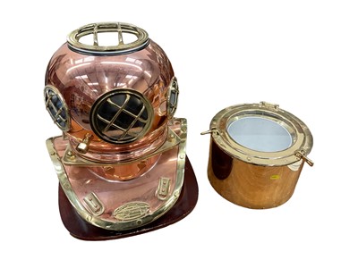 Lot 2435 - Unusual novelty ice bucket in the form of a U.S. Navy copper snd brass divers helmet together with a novelty brass ice bucket in the form of a porthole (2)