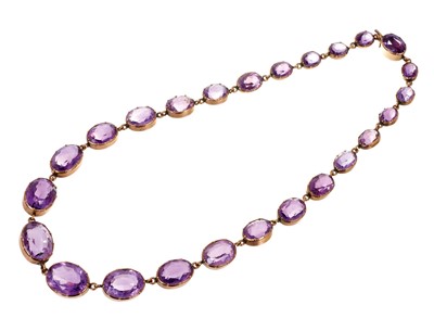 Lot 470 - Victorian amethyst and gold rivière necklace with graduated oval mixed cut amethysts in gold collet setting