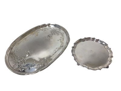 Lot 260 - George V silver oval dressing table tray and a silver card salver (2)
