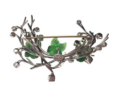 Lot 54 - 1960s Christian Dior paste set floral spray brooch with three green lucite flowers, 6.5cm