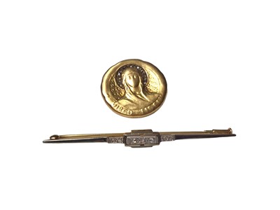Lot 59 - Yellow and white metal bar brooch set with rose cut diamonds and a yellow metal disc 'Virgo Fidelis' brooch depicting Mary with a diamond set halo (2)