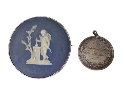Lot 60 - Jasperware porcelain disc in a white metal brooch mount and a white metal medallion dated 1844