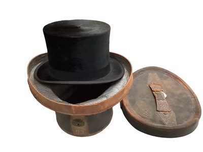 Lot 2105 - Black top hat by Woodrow, Piccadilly, London in leather top hat box.