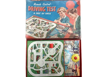 Lot 1964 - Merit vintage Driving Test game, tin plate clockwork penguin, Charbens Series Fire Engine & pistol (qty)