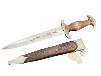 Lot 931 - Nazi SA man's dagger with etched blade by E.P.&S. Solingen retaining all original polish with scabbard and original hanger with belt loop. A sleeper with label saying it was exchanged for cigarette...