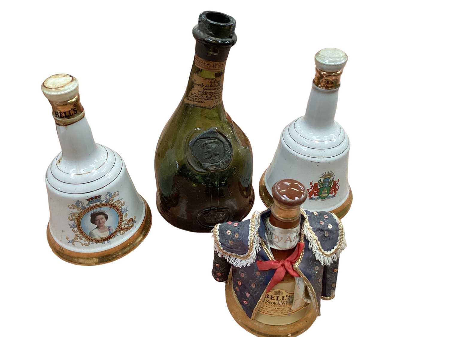 Lot 2478 - Three commemorative Bell's whisky decanters (full) and an old Armagnac bottle
