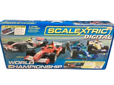 Lot 1974 - Scalextric Digital World Championship multi-car racing with lane changes, lap counter and four racing cars including McLaren Mercedes, Ferrari, Renault & Honda Teams, boxed (1)