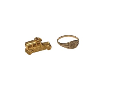 Lot 119 - 1970s 9ct gold signet ring with engraved initials and a gold plated car charm (2)