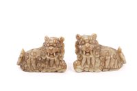 Lot 761 - Pair of antique Chinese carved jade or grey...