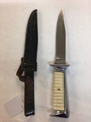 Lot 944 - German Hunting knife with polished steel blade by Ern Wald, Solingen and ribbed plastic grip, in leather sheath.