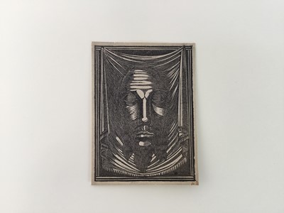Lot 23 - Eric Gill (1882-1940) wood engraving, The Holy Face 1917 (Skelton P111) 7.5 x 5.6cm. Provenance: Gifted by Gill to his Chaplain, Dr. Flood