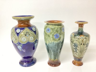 Lot 1262 - Three Royal Doulton stoneware vases on green and blue ground, tallest is 28.5cm high