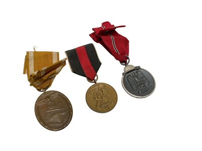 Lot 839 - Three Nazi War Medals comprising West Wall Medal, Sudetenland Medal and Eastern Front medal (3)