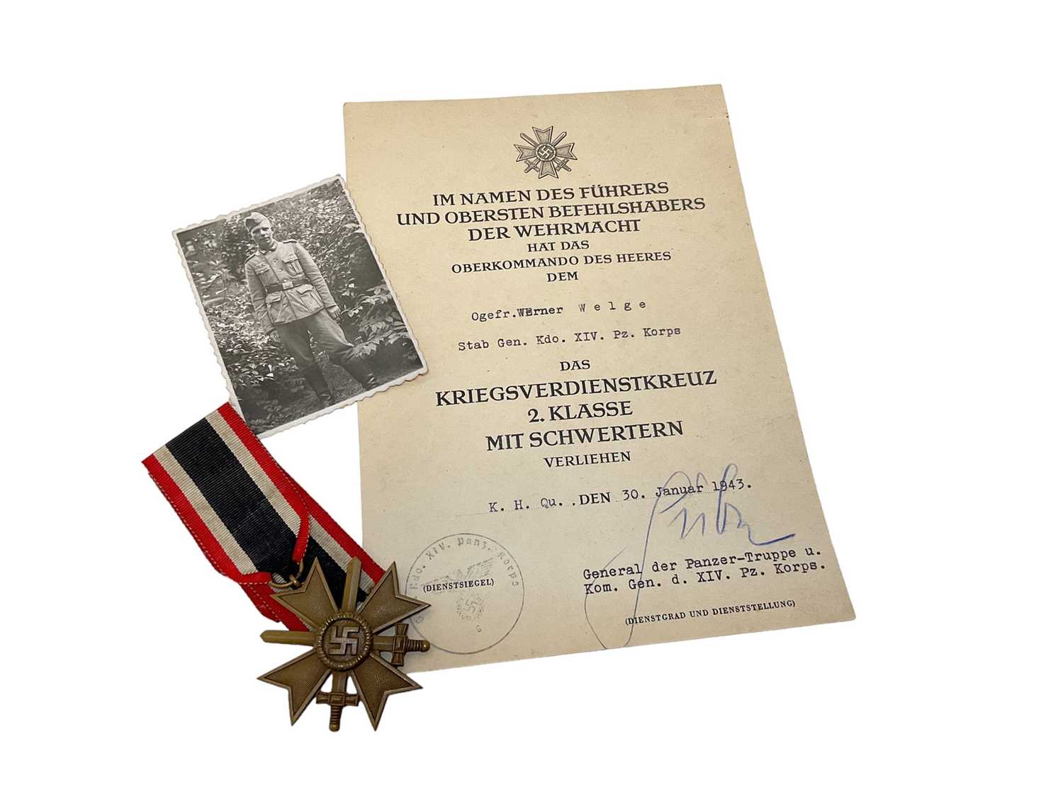 Lot 850 - Nazi War Merit Cross Second Class with swords with original citation dated January 1943 ( awarded to Panzer Korps) complete with a photograph of the recipient in uniform . Provenance:Being sold by...