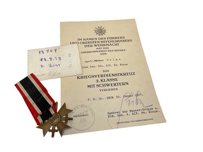 Lot 850 - Nazi War Merit Cross Second Class with swords with original citation dated January 1943 ( awarded to Panzer Korps) complete with a photograph of the recipient in uniform . Provenance:Being sold by...