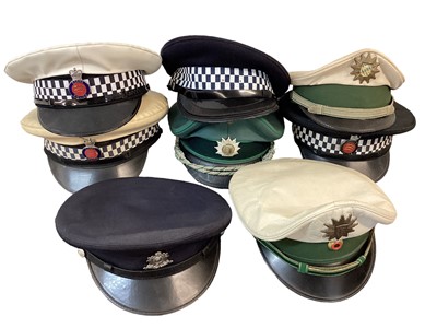 Lot 873 - Collection of Police hats, helmets and head gear to include Essex Police motorcycle helmet, (1 box).