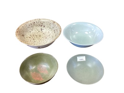 Lot 1283 - Yeap Poh Chap (1927-2007) four bowls to include a celadon glazed bowl, all signed, the largest 24cm diameter (4).