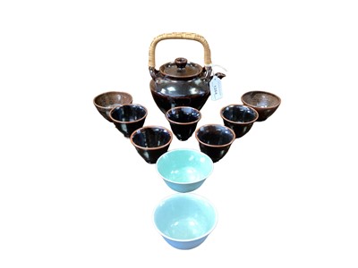 Lot 1284 - Yeap Poh Chap (1927-2007) teapot with cane handle and nine assorted tea bowls, all signed. (10)
