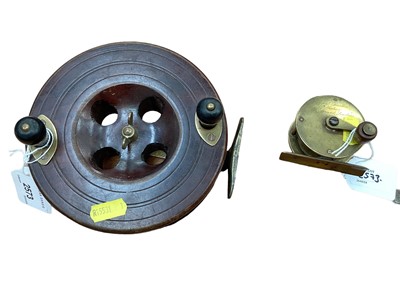 Lot 2573 - Eton Sun wood and brass fishing reel and a brass fishing reel by Charles Farlow dated mid 1800's, The Strand London (2)
