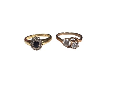 Lot 242 - 18ct gold sapphire and diamond cluster ring and a 9ct gold synthetic two stone ring (2)