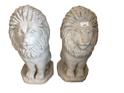Lot 2565 - Pair of grey painted concrete garden statues of lions, 50cm high