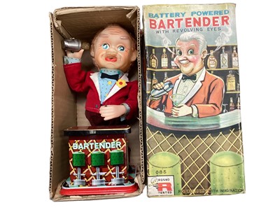 Lot 50 - Rosko Battery operated Bartender with revolving eyes, in original box, plus a Cragstan Crapshooter battery operated toy (2)