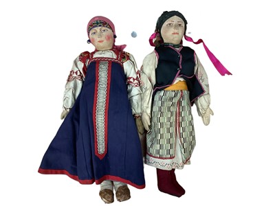 Lot 2025 - Russian Dolls Three 1920 stockinette fabric dolls in traditional costume and similar small dolls.