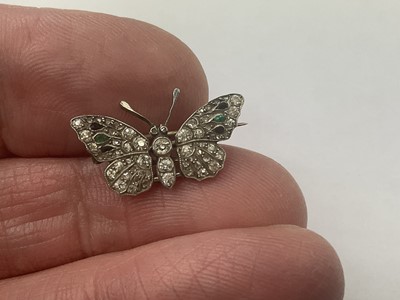 Lot 486 - Edwardian diamond emerald and black onyx butterfly brooch