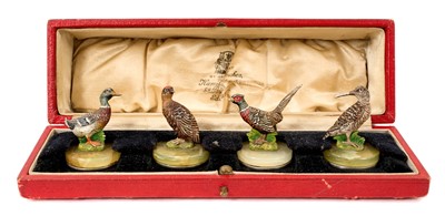 Lot 930 - Set of four early 20th century cold painted menu holders, each mounted with a game bird, on green onyx and chromium bases, in orignal fitted case