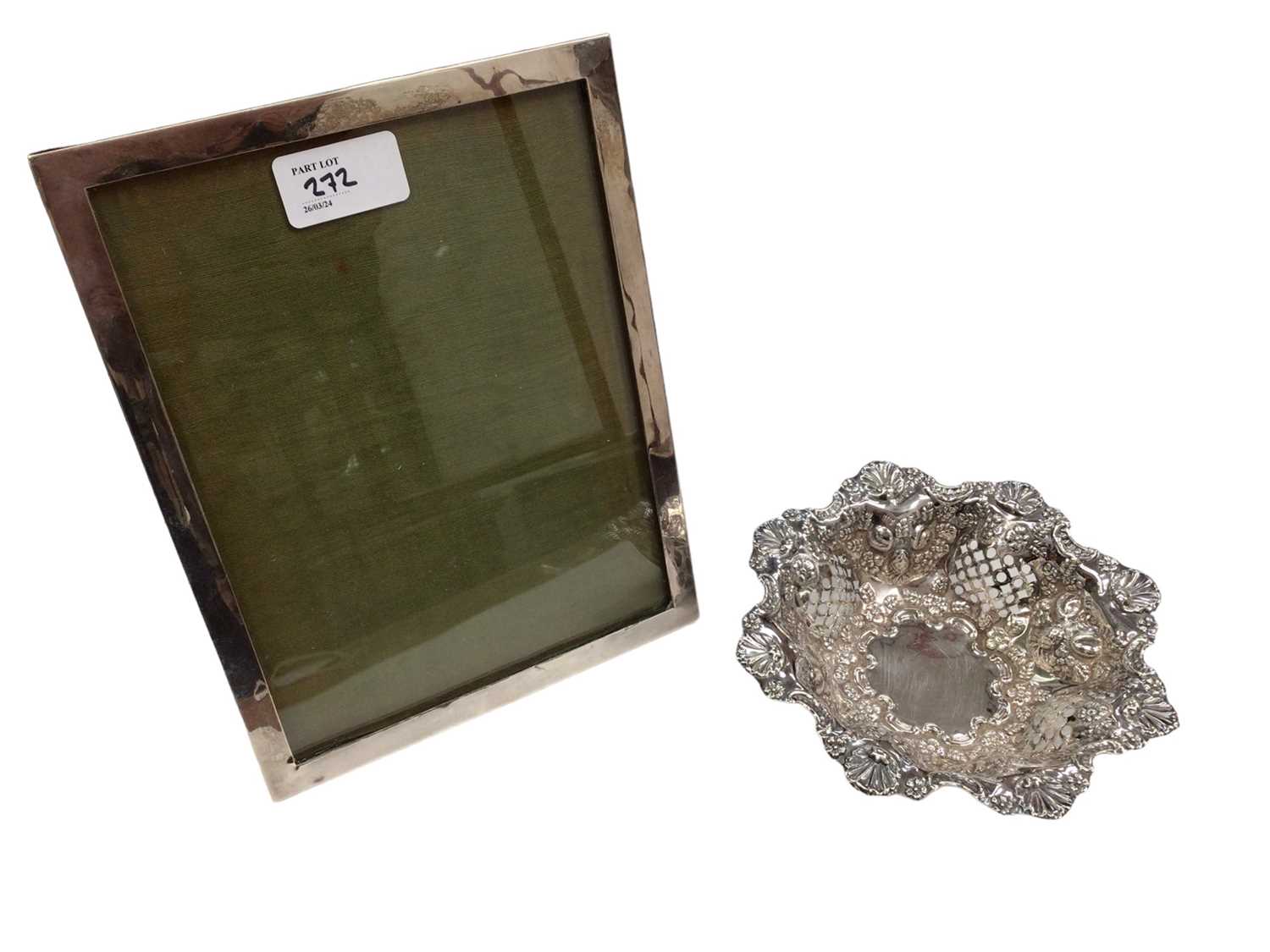 Lot 272 - Victorian silver bonbon dish, (Chester 1897) together with a silver photograph frame (2).