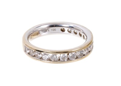 Lot 501 - Diamond eternity ring with a band of brilliant cut diamonds in 18ct white gold channel setting