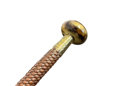 Lot 955 - 1930s French Basque Region, Makhila, with carved Medlar wood shaft and decorative brass ferrule engraved “AINCIART LARRESSORE” and Swastika, the woven leather handle with horn rondel top and brass...
