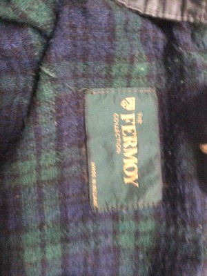 Lot 2048 - Women's navy wax jacket with tartan lining from the Formoy Collection made in Ireland size SX plus two waxed cotton Hats with tartan bands and lining, size M.
