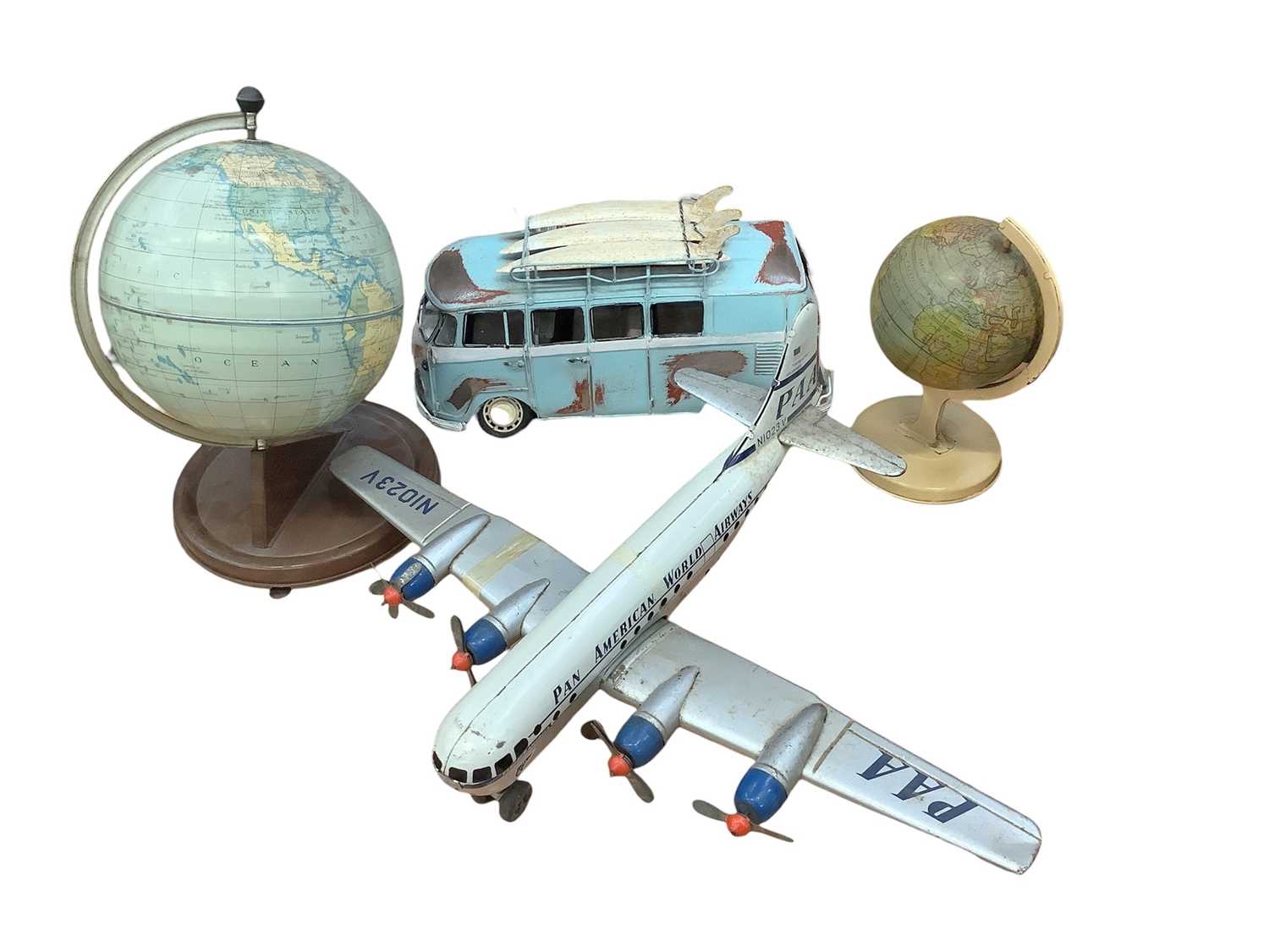 Lot 1798 - Tinplate Pan American World Airways aeroplane made in Western Germany, two tinplate World Globes one by Chad Valley and a tinplate surfers wagon