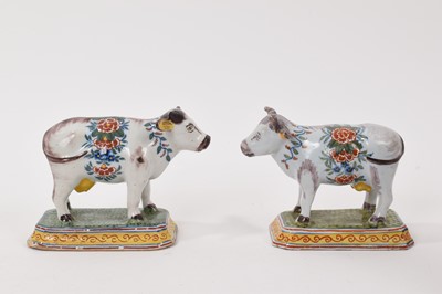 Lot 83 - Pair of Dutch Delft models of cows