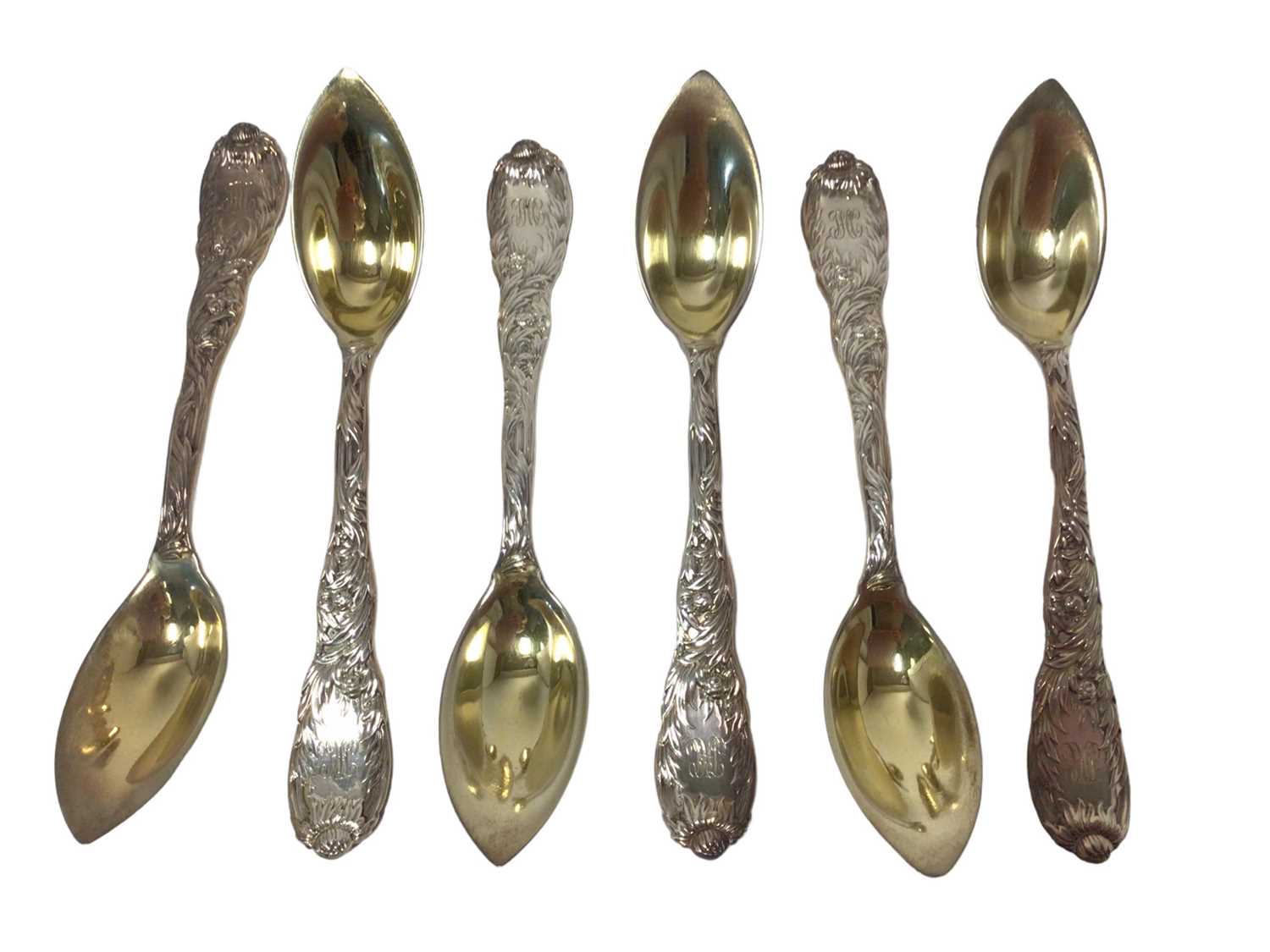 Lot 360 - Set of six Tiffany silver gilt Chrysanthemum pattern fruit/orange spoons