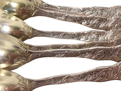 Lot 360 - Set of six Tiffany silver gilt Chrysanthemum pattern fruit/orange spoons
