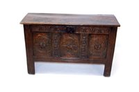 Lot 1429 - 17th century carved oak coffer, the plank top...