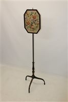 Lot 1432 - Regency ebonised pole screen, the canted...