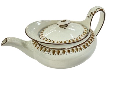 Lot 164 - Wedgwood pearlware oval teapot and cover, painted in brown
